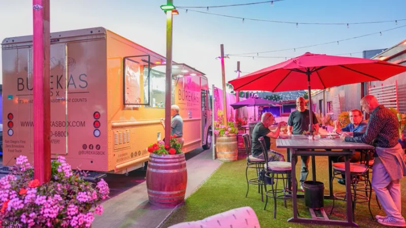 The Burekas Box truck beside outdoor tables and guests