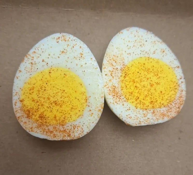 A seasoned hard-boiled egg, halved
